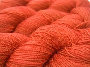 Semi-solid fiery orange superwash Bluefaced Leicester (BFL) 4-ply/fingering/sock yarn. Hand-dyed by Triskelion Yarn