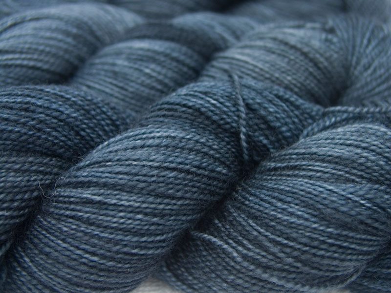 Dark slate grey superwash Bluefaced Leicester (BFL) 4-ply/fingering/sock yarn. Hand-dyed by Triskelion Yarn