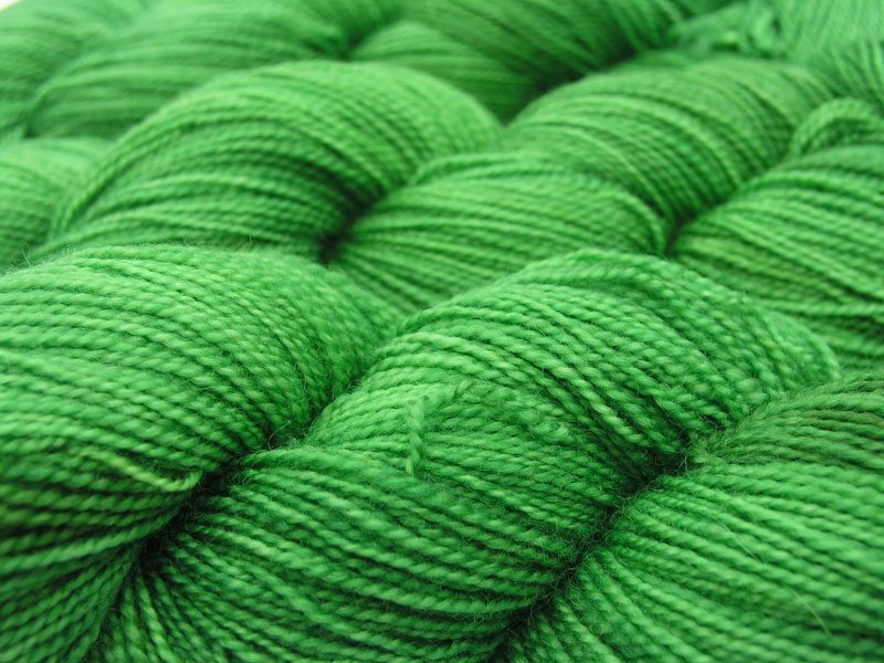 Semi-solid pasture green superwash Bluefaced Leicester (BFL) 4-ply/fingering/sock yarn. Hand-dyed by Triskelion Yarn