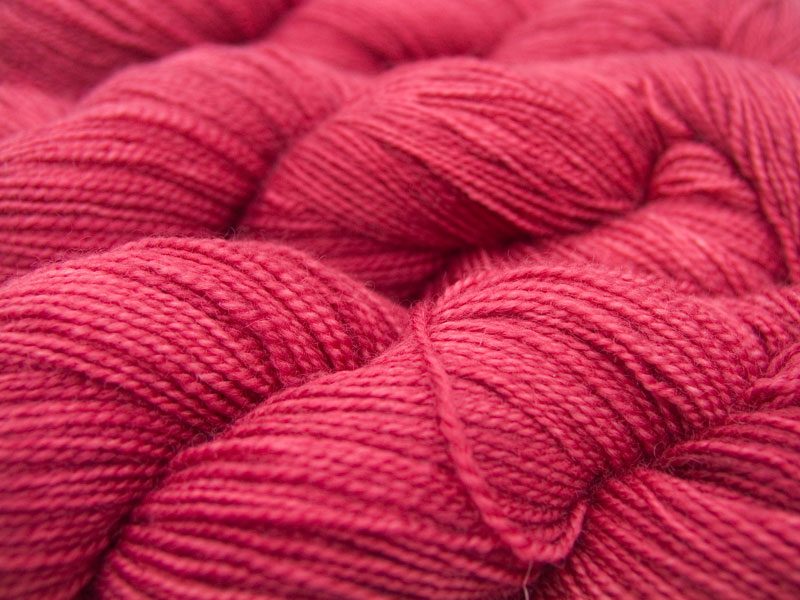 Deep rose superwash Bluefaced Leicester (BFL) 4-ply/fingering/sock yarn. Hand-dyed by Triskelion Yarn
