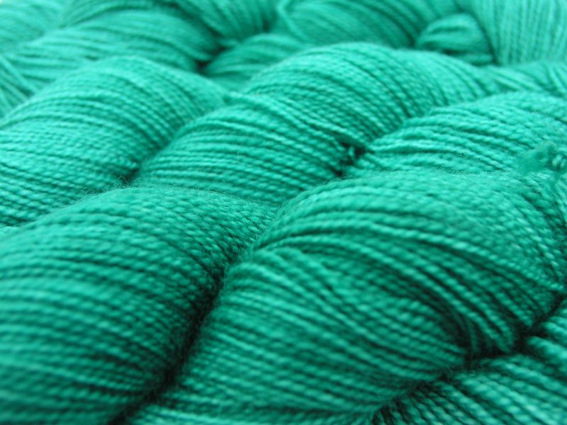 Turquoise green superwash Bluefaced Leicester (BFL) 4-ply/fingering/sock yarn. Hand-dyed by Triskelion Yarn