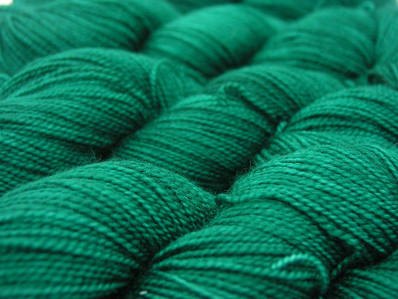 Semi-solid deep woodland green superwash Bluefaced Leicester (BFL) 4-ply/fingering/sock yarn. Hand-dyed by Triskelion Yarn