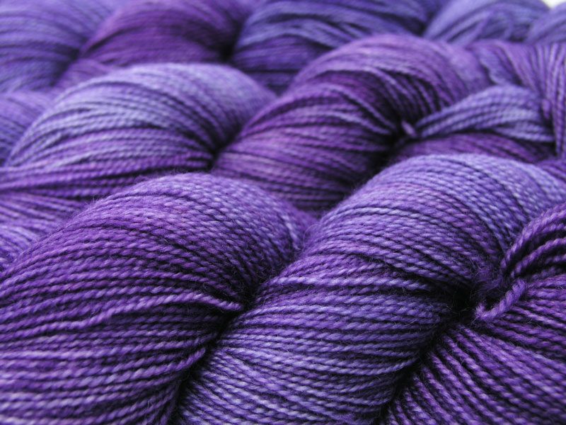 Semi-solid mid-tone purple superwash Bluefaced Leicester (BFL) 4-ply/fingering/sock yarn. Hand-dyed by Triskelion Yarn
