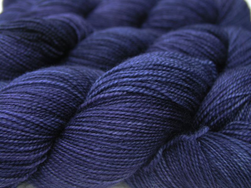 Semi-solid deep purple and blue-violet superwash Bluefaced Leicester (BFL) 4-ply/fingering/sock yarn. Hand-dyed by Triskelion Yarn