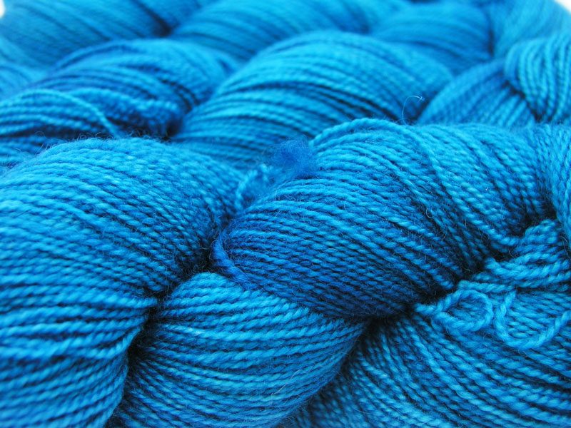 Semi-solid cerulean blue superwash Bluefaced Leicester (BFL) 4-ply/fingering/sock yarn. Hand-dyed by Triskelion Yarn