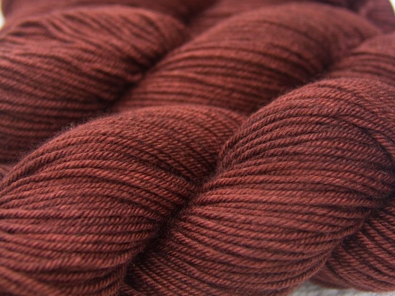 rich, dark chestnut brown Bluefaced Leicester, silk & cashmere double knit yarn. Hand-dyed by Triskelion Yarn.