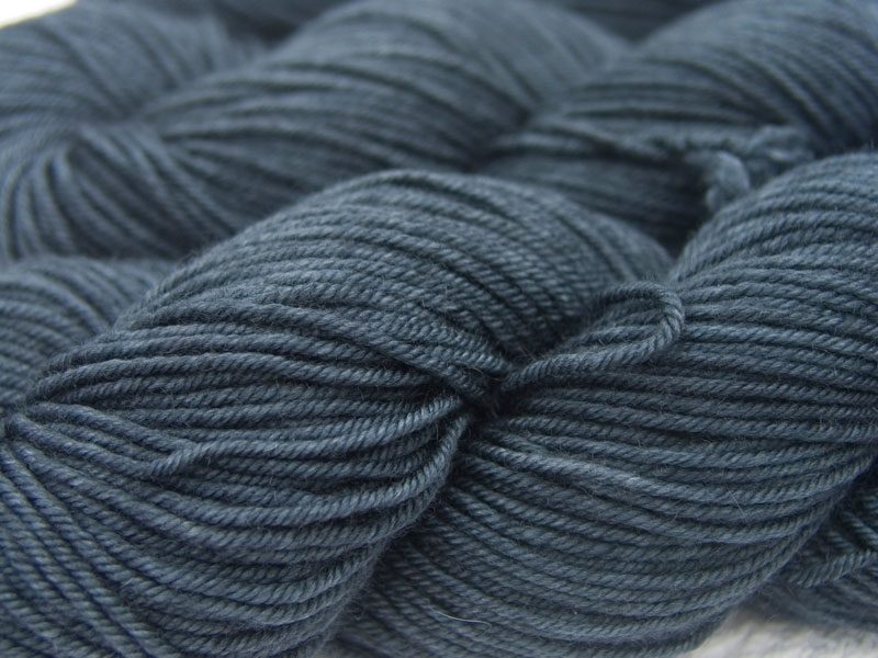 Dark, slate blue-grey Bluefaced Leicester, silk & cashmere double knit yarn. Hand-dyed by Triskelion Yarn.