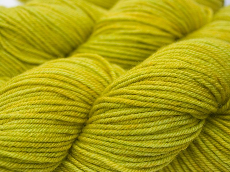 Chartreuse green Bluefaced Leicester, silk & cashmere double knit yarn. Hand-dyed by Triskelion Yarn.