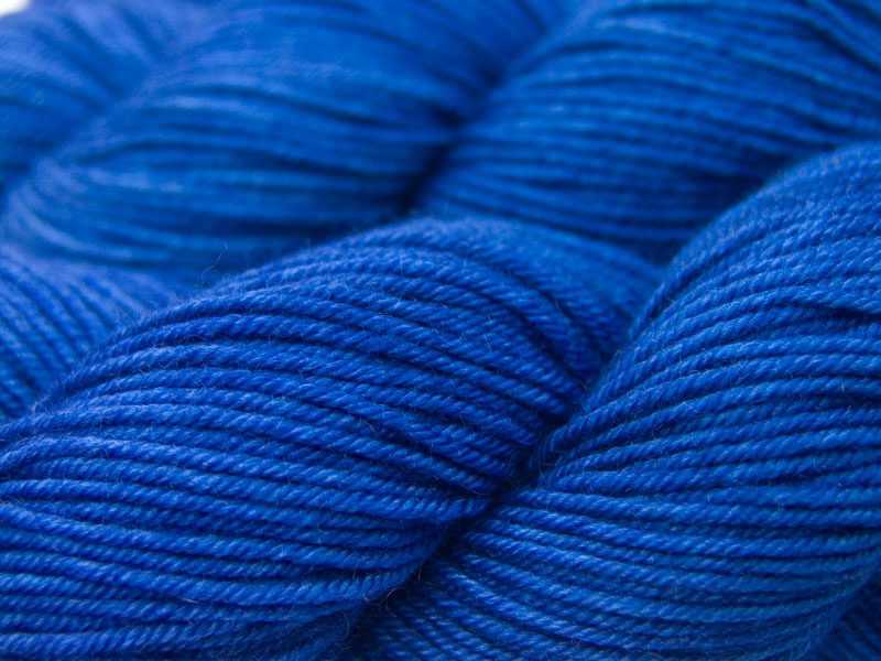 Deep indigo blue Bluefaced Leicester, silk & cashmere double knit yarn. Hand-dyed by Triskelion Yarn.
