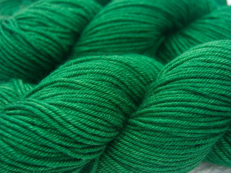 Mid-tone emerald green Bluefaced Leicester, silk & cashmere double knit yarn. Hand-dyed by Triskelion Yarn.