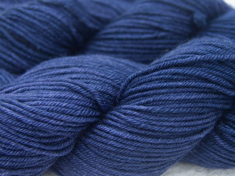 Deep violet-purple Bluefaced Leicester, silk & cashmere double knit yarn. Hand-dyed by Triskelion Yarn.