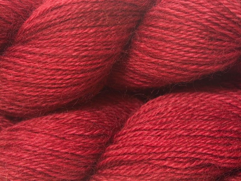 Semi-solid deep red hand-dyed Wensleydale DK/ Double Knit yarn. Hand-dyed by Triskelion Yarn