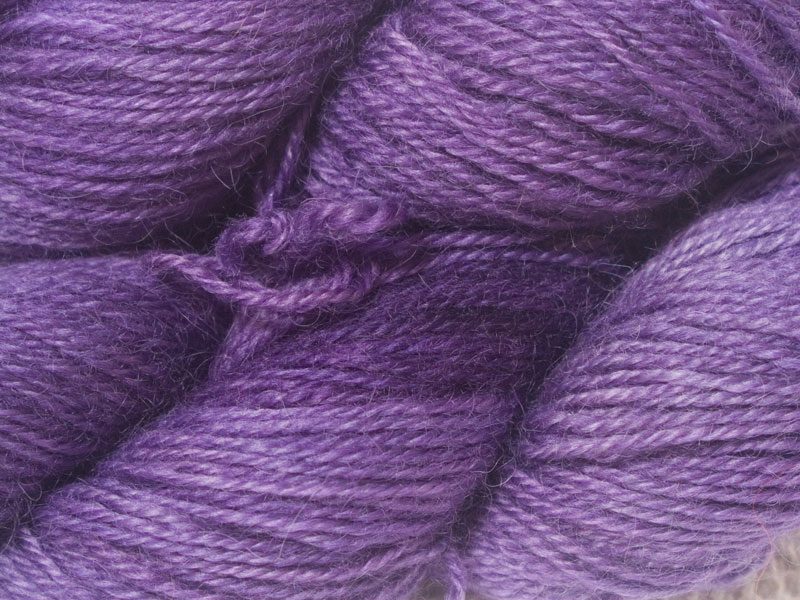 Semi-solid mid-tone purple hand-dyed Wensleydale DK/ Double Knit yarn. Hand-dyed by Triskelion Yarn