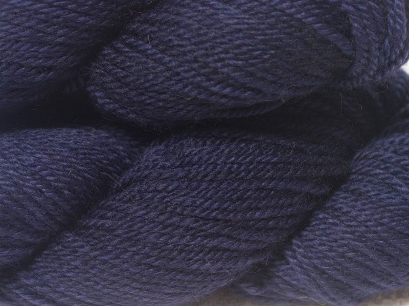 Semi-solid deep purple and blue-violet Bluefaced Leicester (BFL) / Masham aran yarn. Hand-dyed by Triskelion Yarn