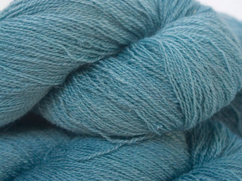 Semi-solid sky blue Bluefaced Leicester laceweight yarn hand-dyed by Triskelion Yarns
