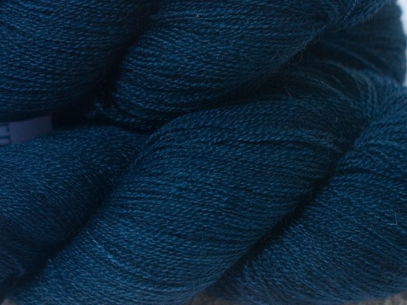 Rich, smoky dark blue Bluefaced Leicester laceweight yarn hand-dyed by Triskelion Yarns