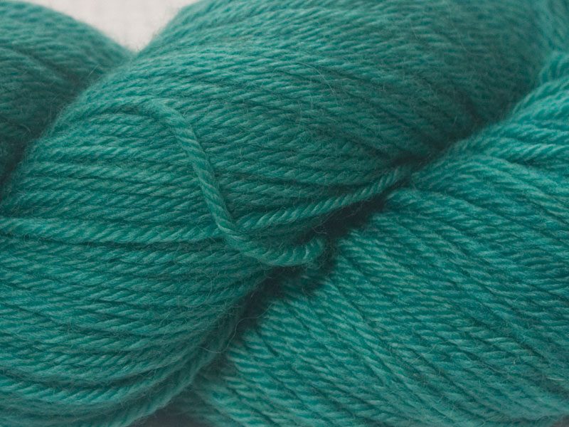 Turquoise superwash British Bluefaced Leicester sportweight yarn. hand-dyed by Triskelion Yarn