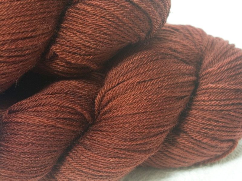 Chestnut brown superwash British Bluefaced Leicester sportweight yarn. hand-dyed by Triskelion Yarn