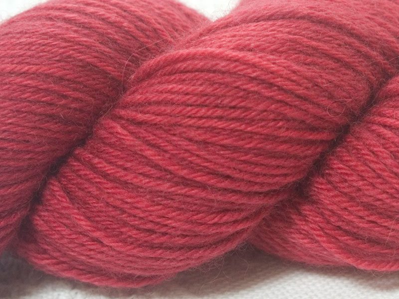 Rose superwash British Bluefaced Leicester sportweight yarn. hand-dyed by Triskelion Yarn