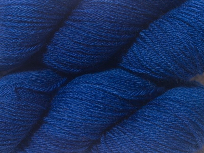 Blue superwash British Bluefaced Leicester sportweight yarn. hand-dyed by Triskelion Yarn