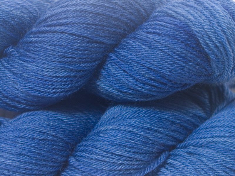 Blue superwash British Bluefaced Leicester sportweight yarn. hand-dyed by Triskelion Yarn
