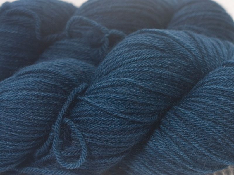Dark petrel blue superwash British Bluefaced Leicester sportweight yarn. hand-dyed by Triskelion Yarn