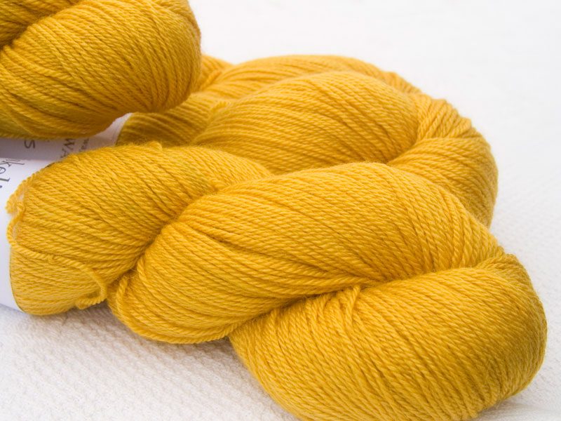 Yellow Bluefaced Leicester, silk & cashmere 4-ply yarn. Hand-dyed by Triskelion Yarn.