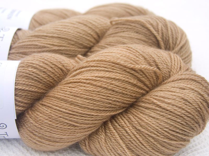 Light Brown Bluefaced Leicester, silk & cashmere 4-ply yarn. Hand-dyed by Triskelion Yarn.