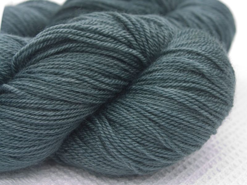 Grey Bluefaced Leicester, silk & cashmere 4-ply yarn. Hand-dyed by Triskelion Yarn.