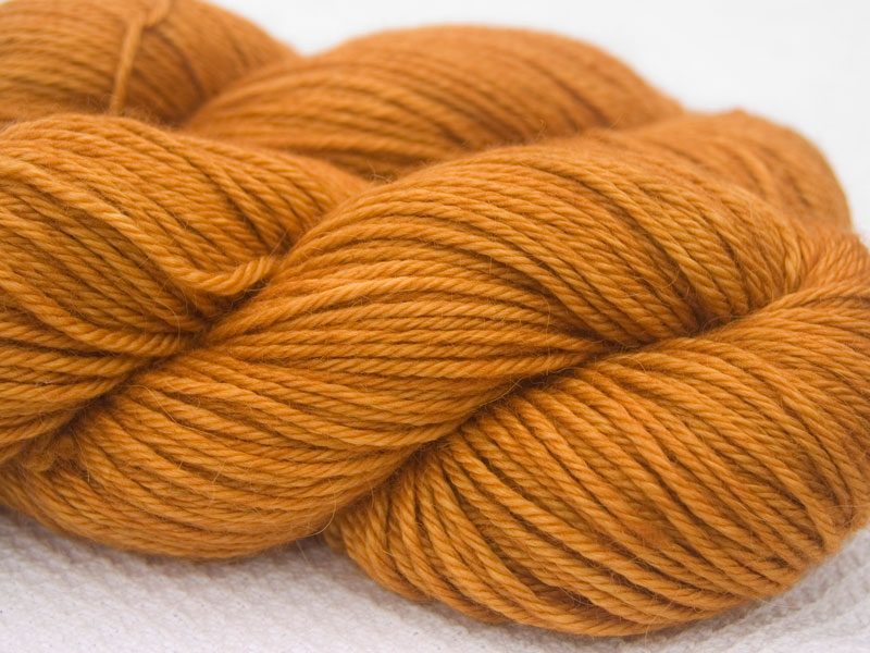Orange Baby Alpaca Silk & Cashmere double-knit yarn. Hand-dyed by Triskelion Yarn.