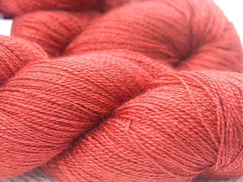 Orange red Bluefaced Leicester laceweight yarn. Hand-dyed by Triskelion Yarn.