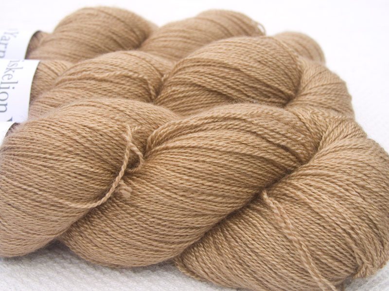 Light brown Bluefaced Leicester laceweight yarn. Hand-dyed by Triskelion Yarn.