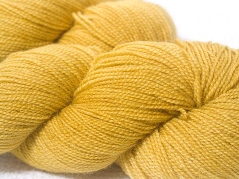 Light yellow superwash Bluefaced Leicester (BFL) 4-ply/fingering/sock yarn. Hand-dyed by Triskelion Yarn