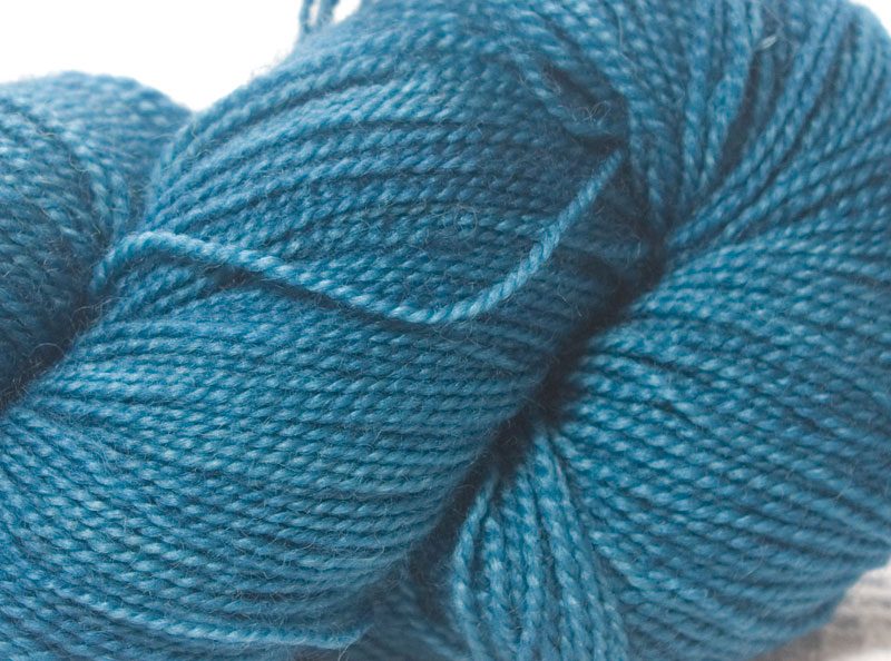Mid-blue superwash Bluefaced Leicester (BFL) 4-ply/fingering/sock yarn. Hand-dyed by Triskelion Yarn