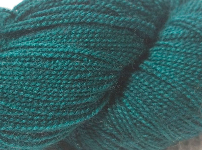 Semi-solid mid-tone blue-green superwash Bluefaced Leicester (BFL) 4-ply/fingering/sock yarn. Hand-dyed by Triskelion Yarn
