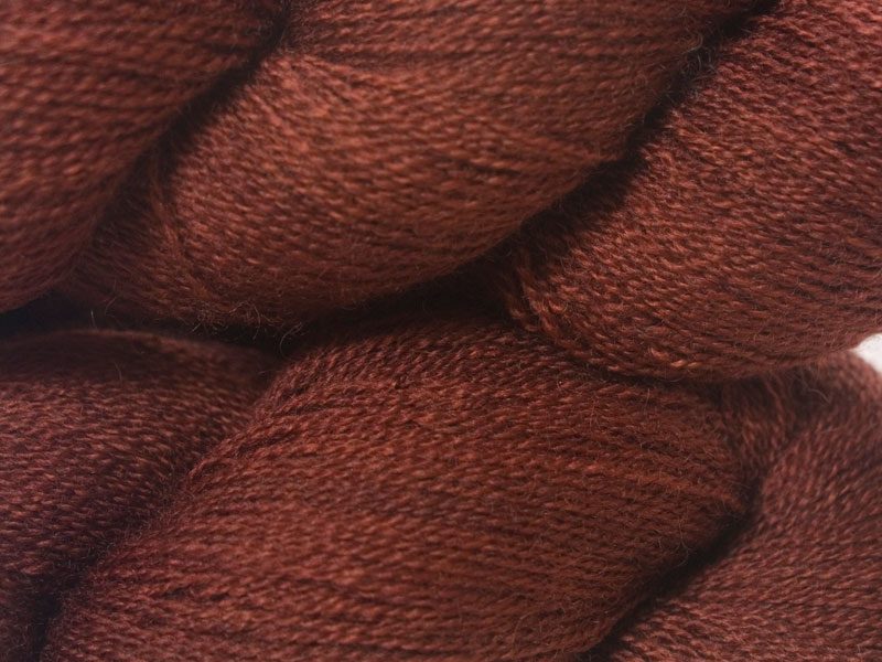 Rich, dark chestnut brown Bluefaced Leicester laceweight yarn hand-dyed by Triskelion Yarns