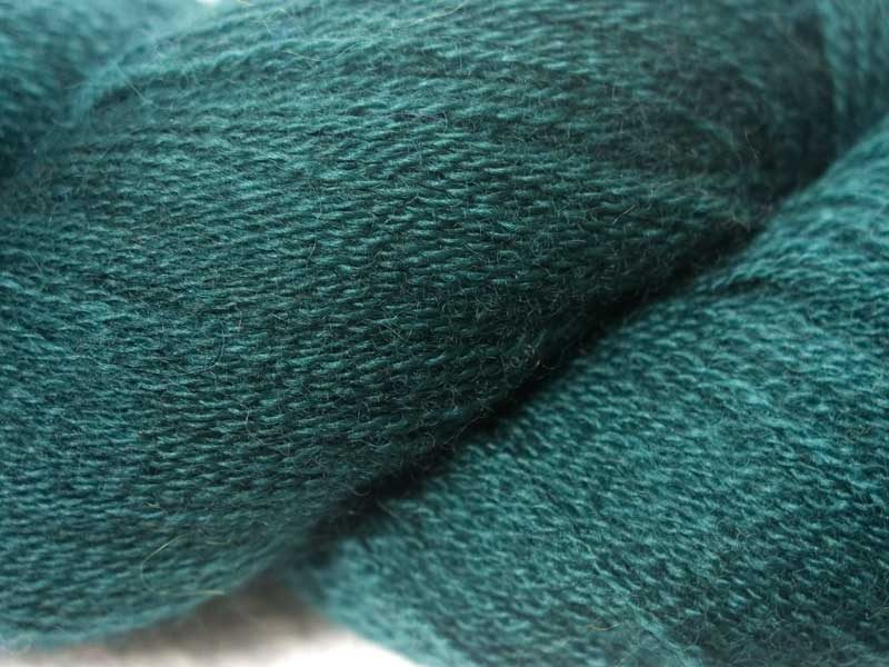 Semi-solid to solid mid-tone blue-green luefaced Leicester laceweight yarn hand-dyed by Triskelion Yarns