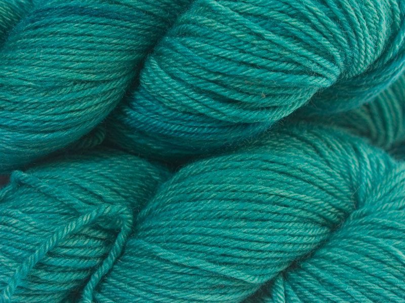 Mid tone bluish green superwash British Bluefaced Leicester sportweight yarn. hand-dyed by Triskelion Yarn