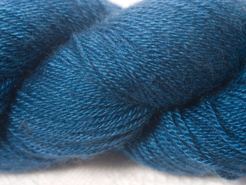 Mid to dark air force blue Bluefaced Leicester, silk & cashmere 4-ply yarn. Hand-dyed by Triskelion Yarn.