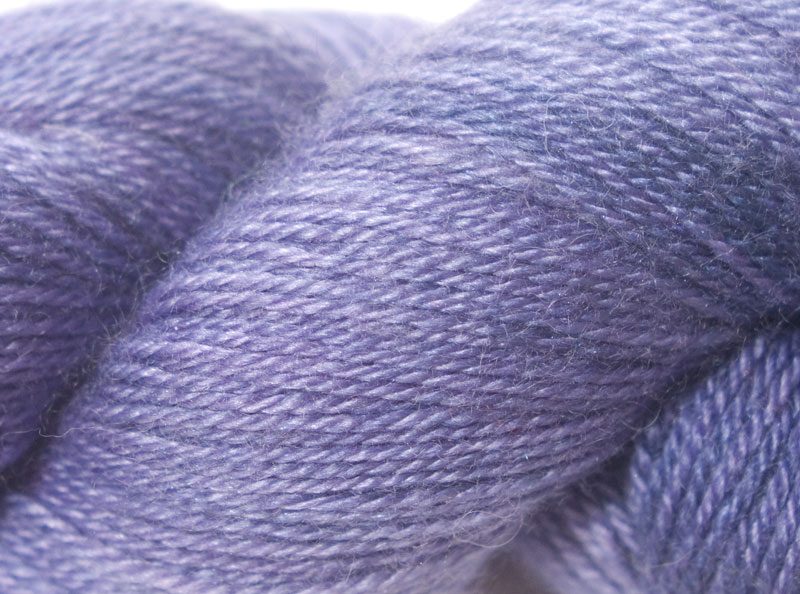 Mid tone purple Bluefaced Leicester, silk & cashmere 4-ply yarn. Hand-dyed by Triskelion Yarn.