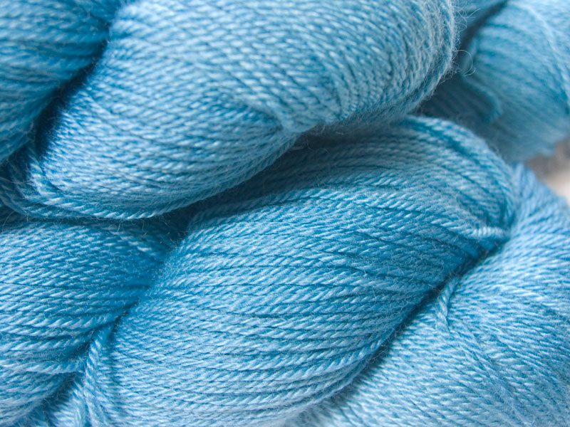 Light sky blue Bluefaced Leicester, silk & cashmere 4-ply yarn. Hand-dyed by Triskelion Yarn.