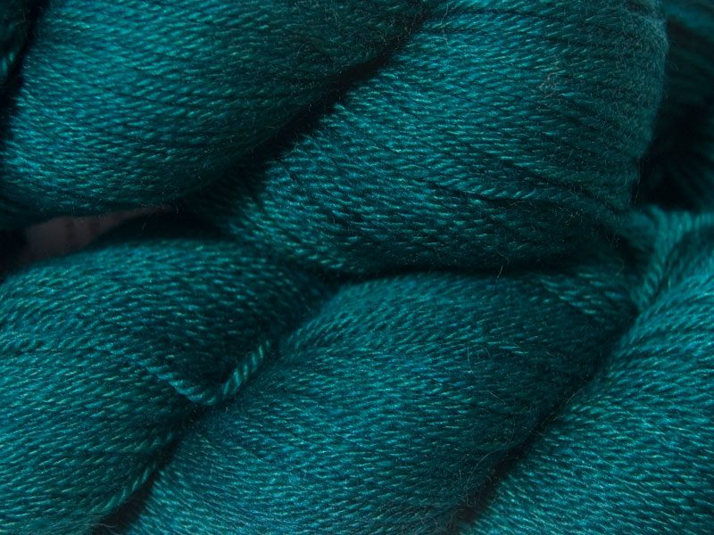 Deep teal with hints of sea green Bluefaced Leicester, silk & cashmere 4-ply yarn. Hand-dyed by Triskelion Yarn.