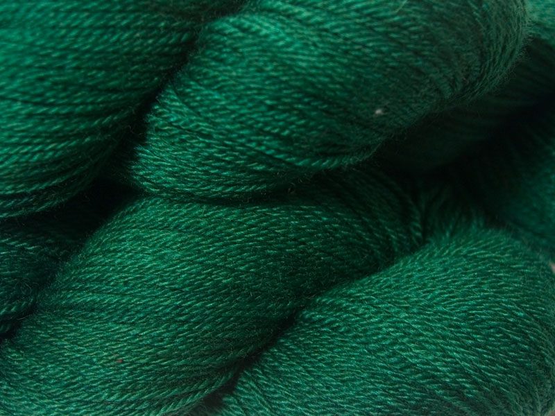 Deep forest green Bluefaced Leicester, silk & cashmere 4-ply yarn. Hand-dyed by Triskelion Yarn.