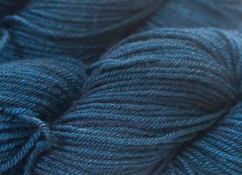 Dark neutral blue Bluefaced Leicester, silk & cashmere double knit yarn. Hand-dyed by Triskelion Yarn.