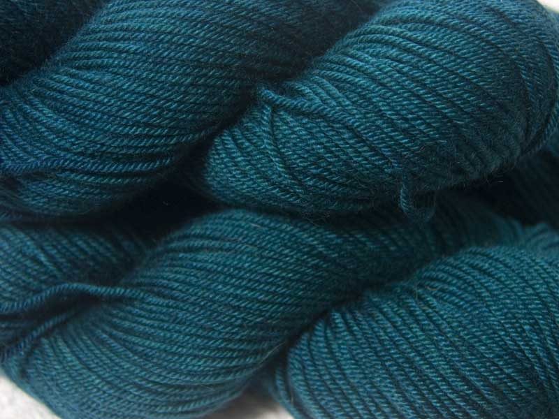 Deep teal with hints of sea green Bluefaced Leicester, silk & cashmere double knit yarn. Hand-dyed by Triskelion Yarn.