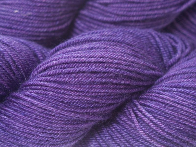 Semi-solid mid-tone purple Bluefaced Leicester, silk & cashmere double knit yarn. Hand-dyed by Triskelion Yarn.