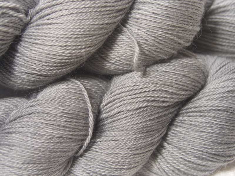 Light to mid neutral grey Baby Alpaca Silk & Cashmere 4-ply yarn. Hand-dyed by Triskelion Yarn.