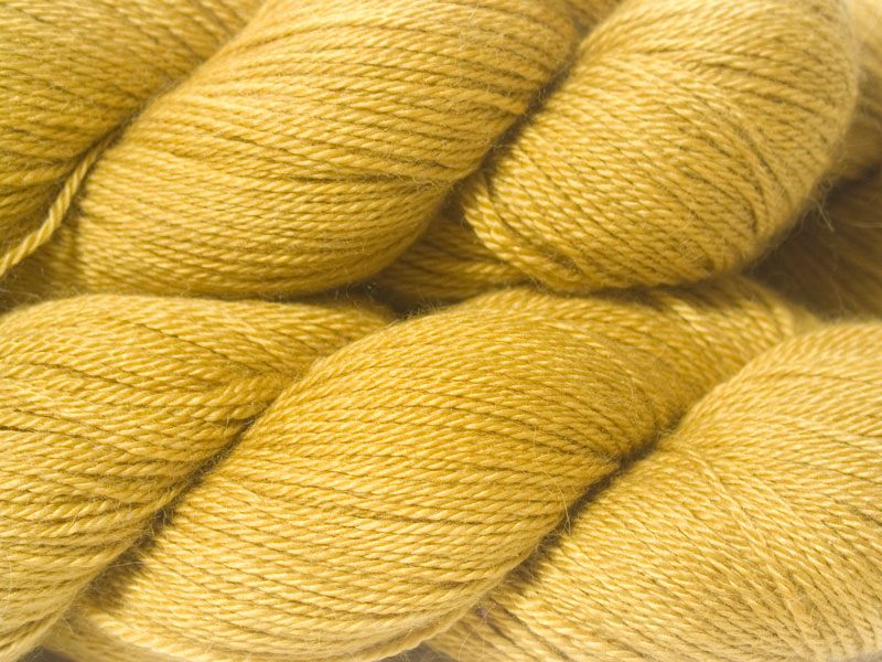 Light yellow Baby Alpaca Silk & Cashmere 4-ply yarn. Hand-dyed by Triskelion Yarn.