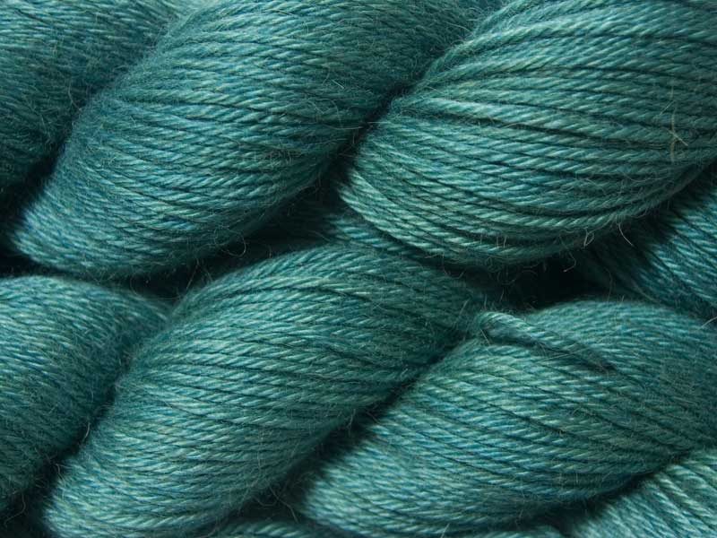 Mid-tone blue-green Baby Alpaca Silk & Cashmere double-knit yarn. Hand-dyed by Triskelion Yarn.