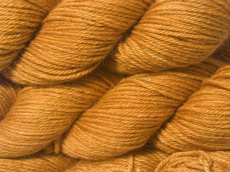 Semi-solid light fiery orange Baby Alpaca Silk & Cashmere double-knit yarn. Hand-dyed by Triskelion Yarn.